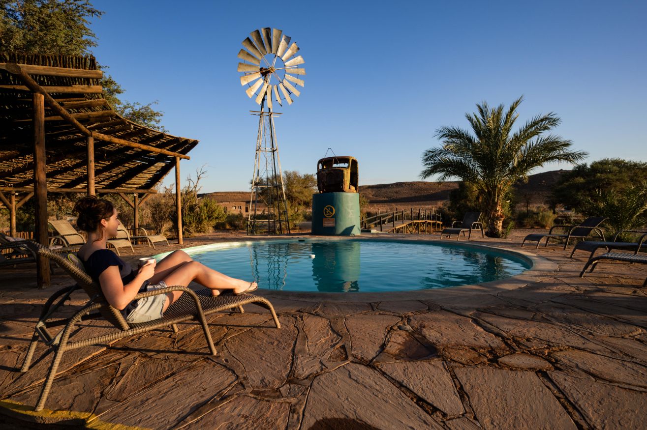 Relaxing by the pool at a Namibian desert lodge